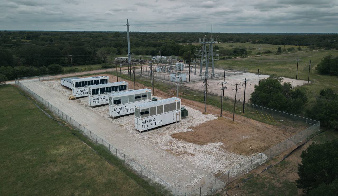 Hydro mining containers beside substation infrastructure