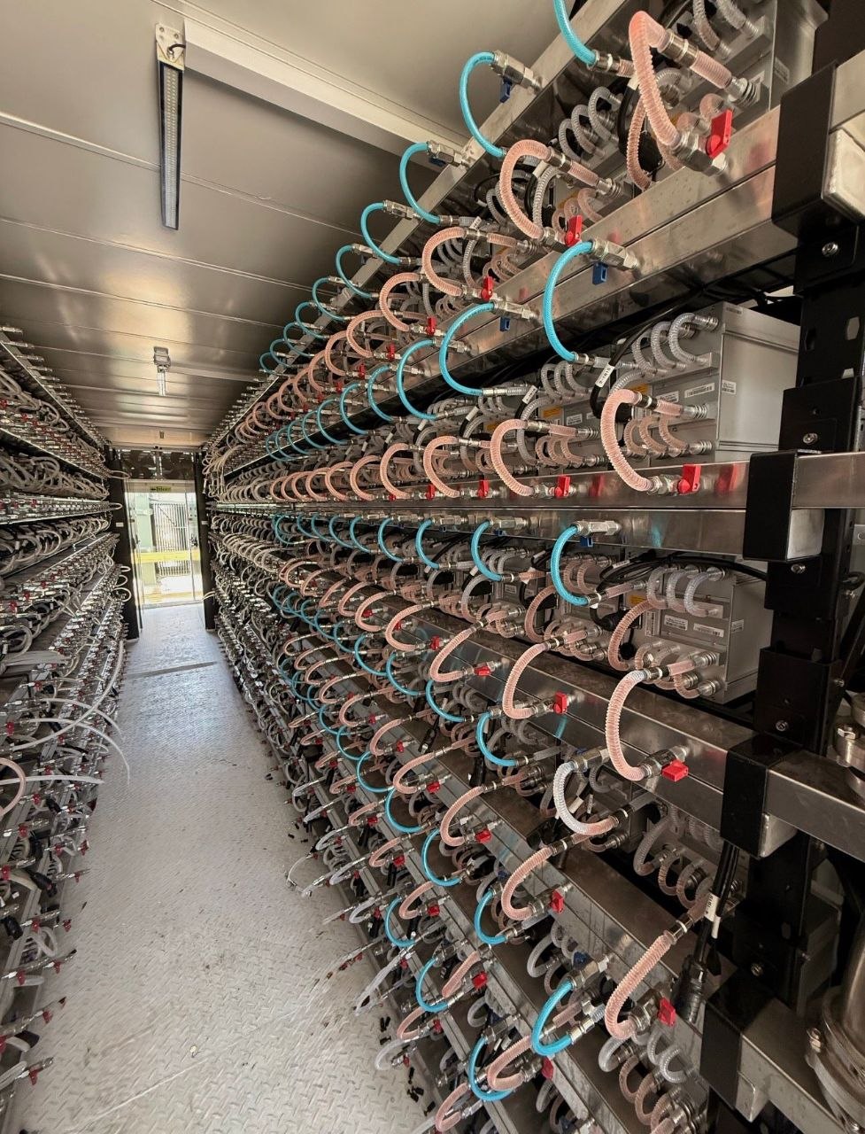 Hydro ASIC racks and coolant lines inside a container